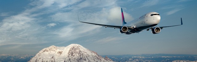 Boeing 737-900ER in flight near Mount Rainier, Seattle, WA.